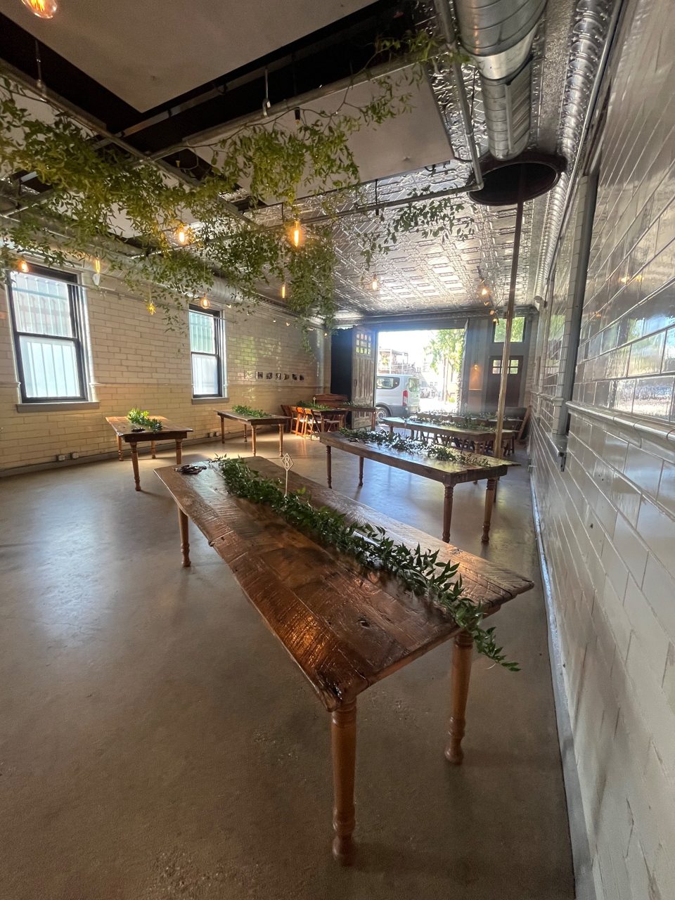 Centerpieces: Hand Laid greenery by Southside Blooms