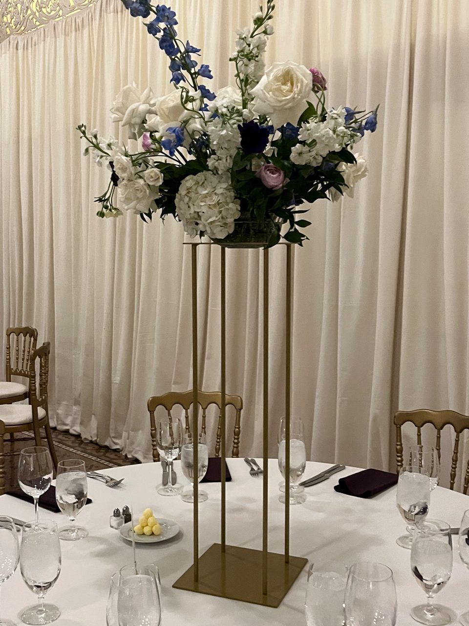 Centerpiece Style 1: Tall centerpieces by Southside Blooms