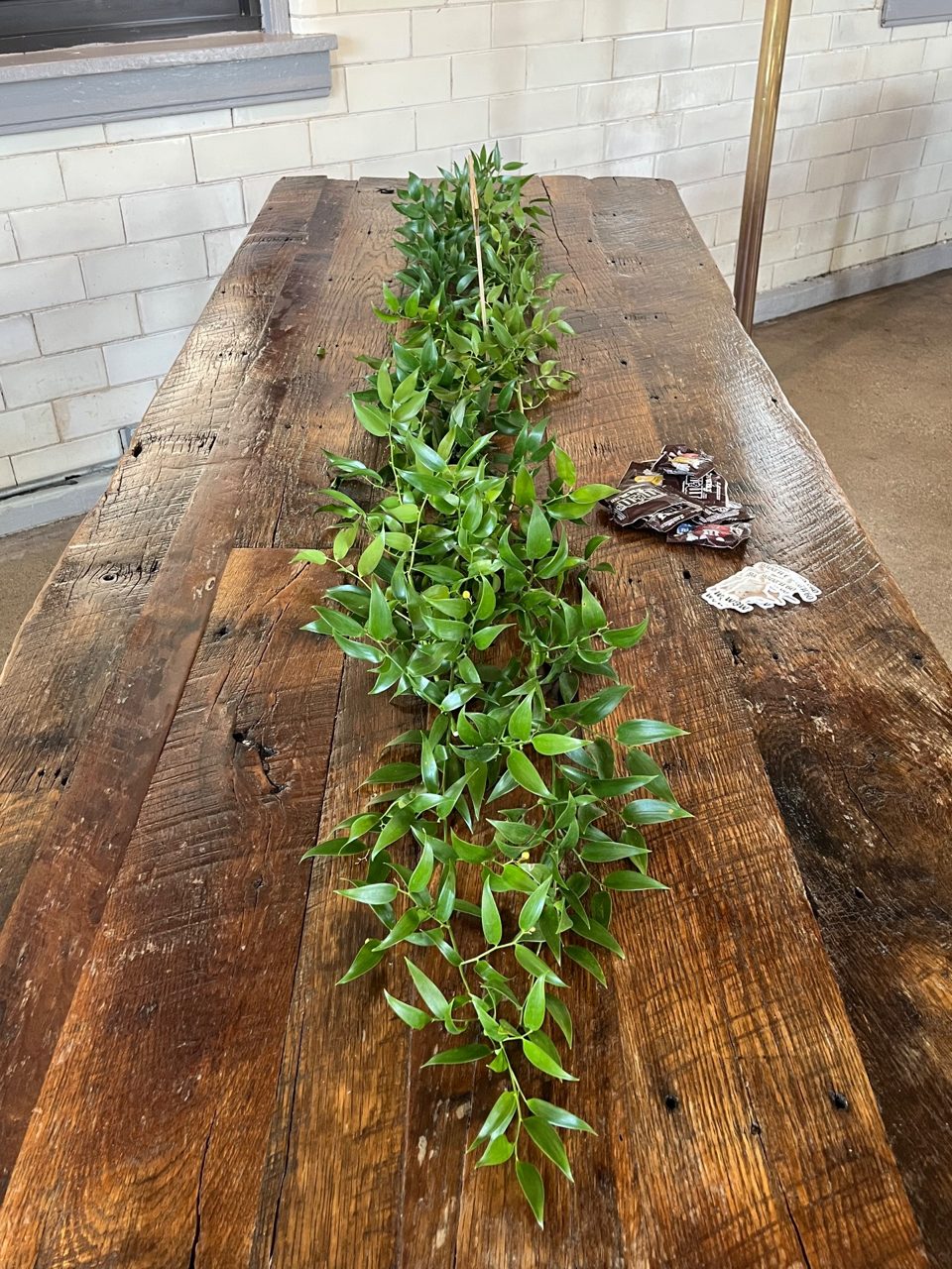 Centerpieces: Hand Laid greenery by Southside Blooms